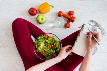 woman writing a diet plan